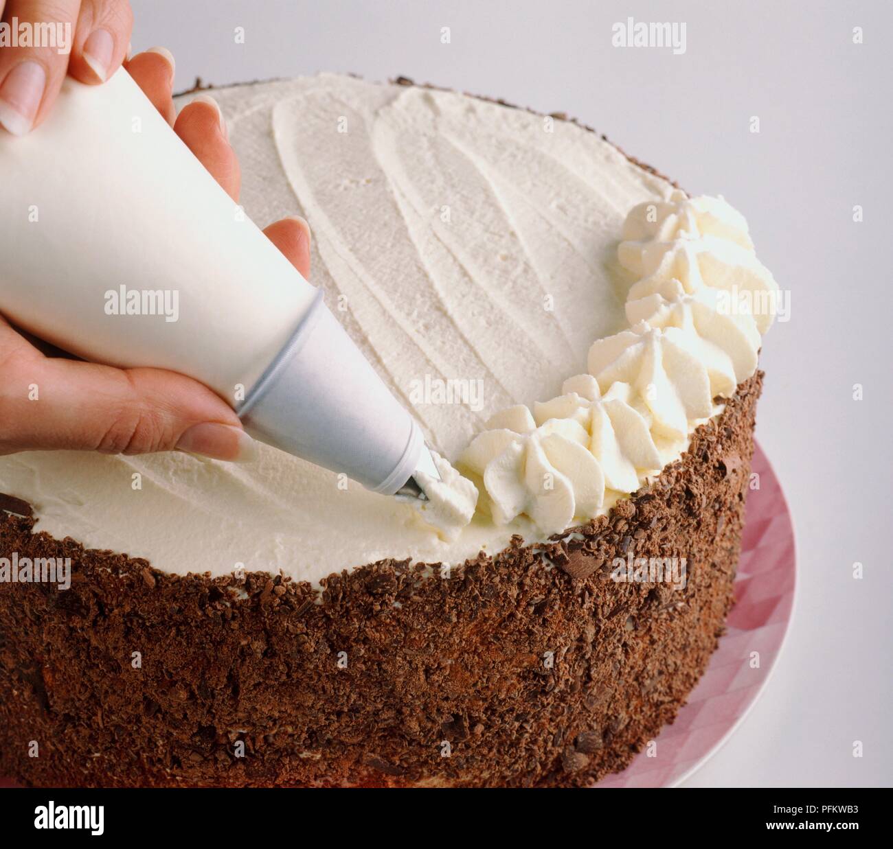 Black Forest Gateau Cream Rosettes Being Piped Around The Edges Close Up Stock Photo Alamy