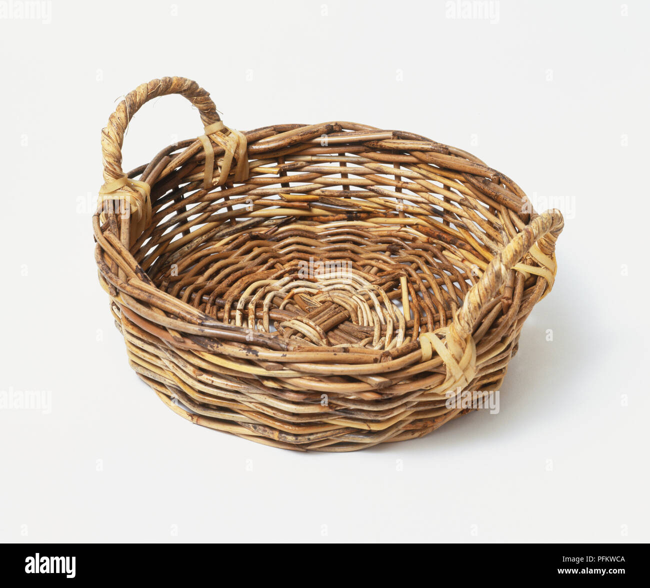 Round woven basket with handles Stock Photo Alamy
