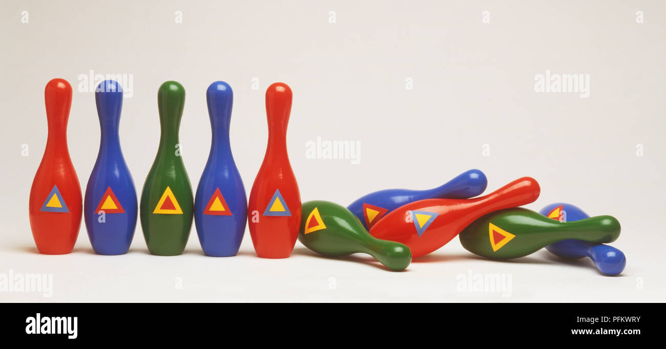 Group of bowling pins, some knocked over Stock Photo Alamy