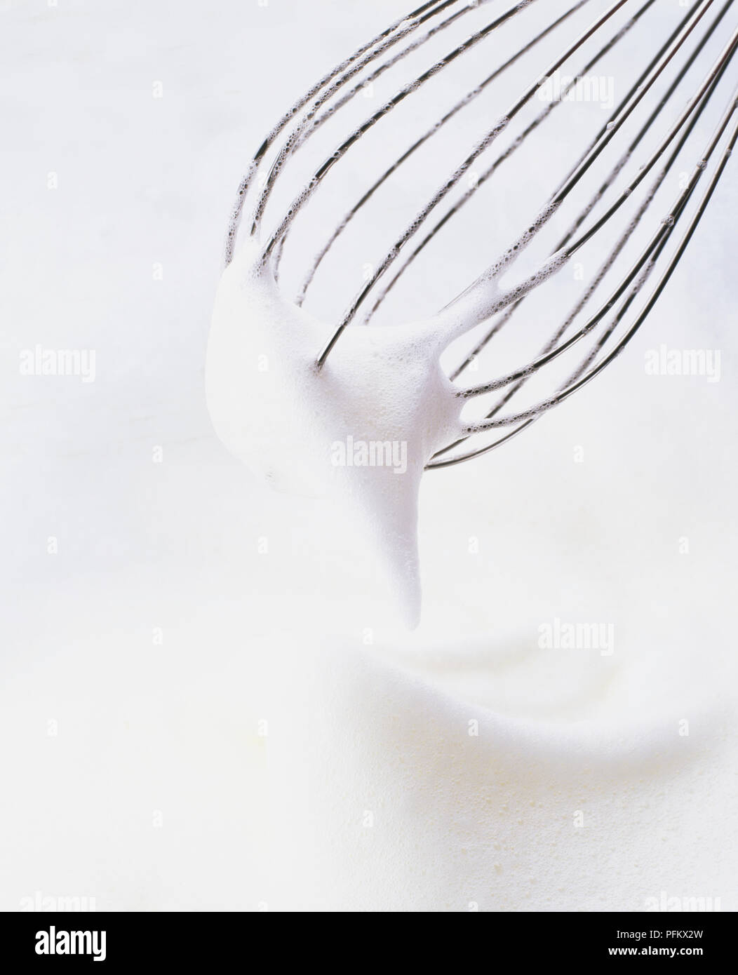 Whisk egg whites to soft peaks Stock Photo Alamy