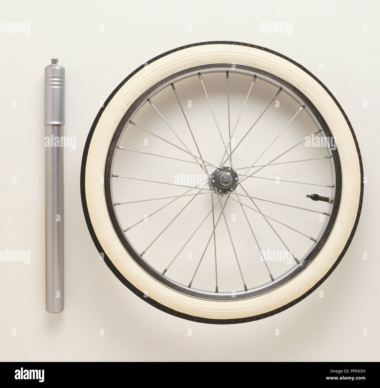 Thermometer, tyre pump and bicycle wheel and tyre Stock Photo