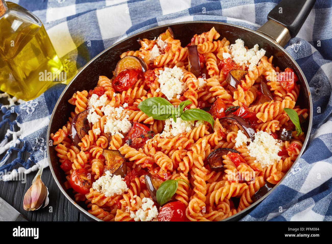 Italian Pasta fusilli alla Norma with eggplant, tomatoes, basil