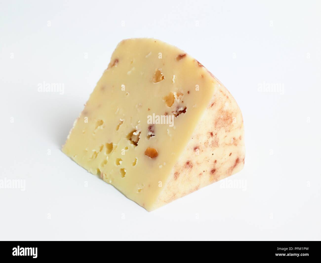 Slice of Spanish Taramundi cow and goat's milk cheese Stock Photo Alamy