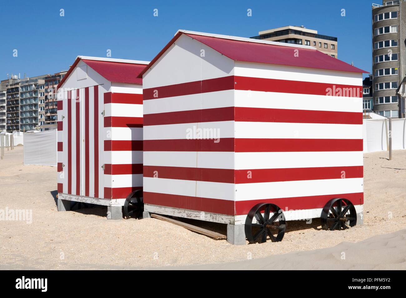 Belgium De Panne Old Fashioned Red And White Striped Beach Huts On Beach With Hotels In Background Stock Photo Alamy