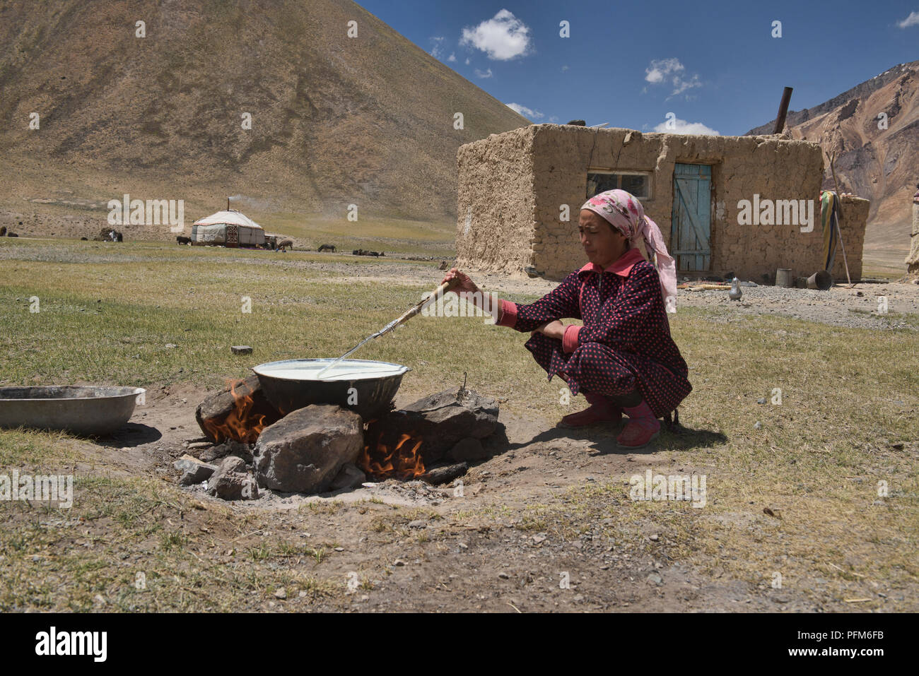 Kyrgyz nomad making dairy products, Pshart Valley, Tajikistan Stock Photo