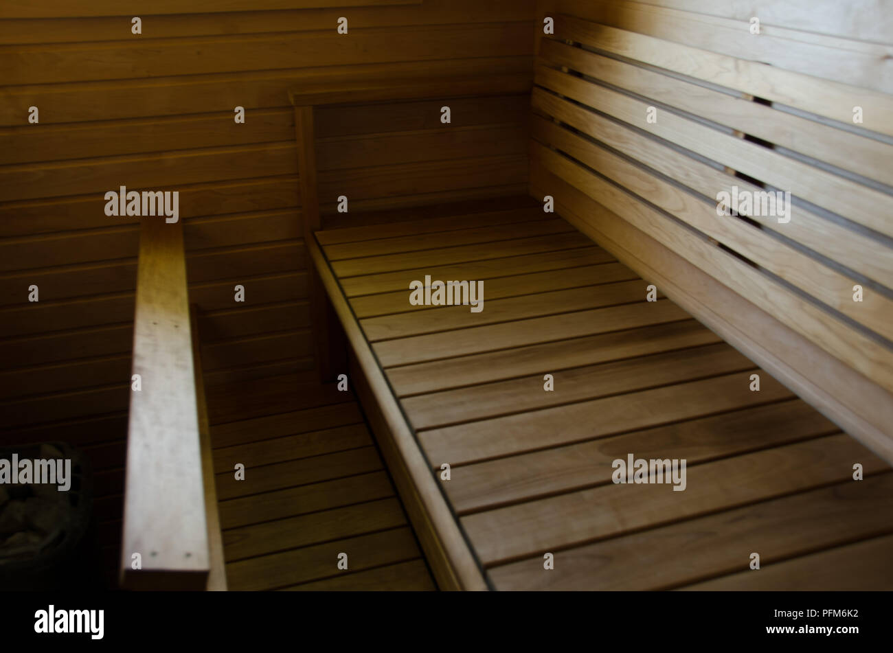 Sauna with sunlight sipping in from the nearby window. Stock Photo