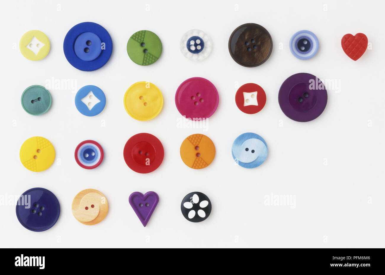 Four rows of buttons, different colours, sizes and shapes Stock Photo