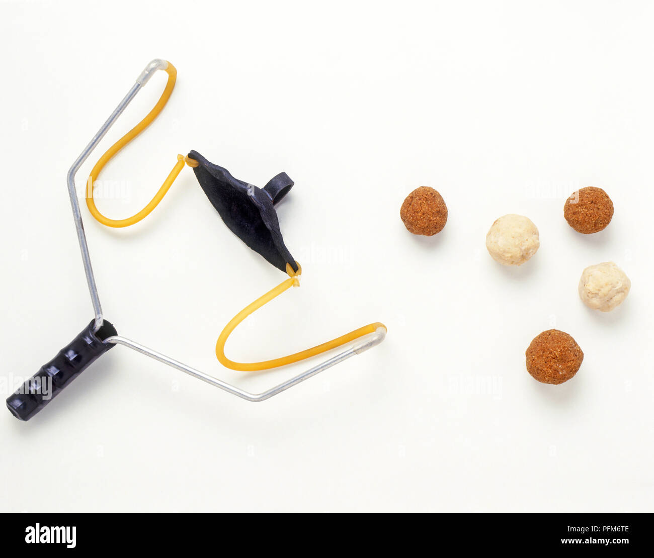 A fishing catapult and balls of fishing bait Stock Photo Alamy
