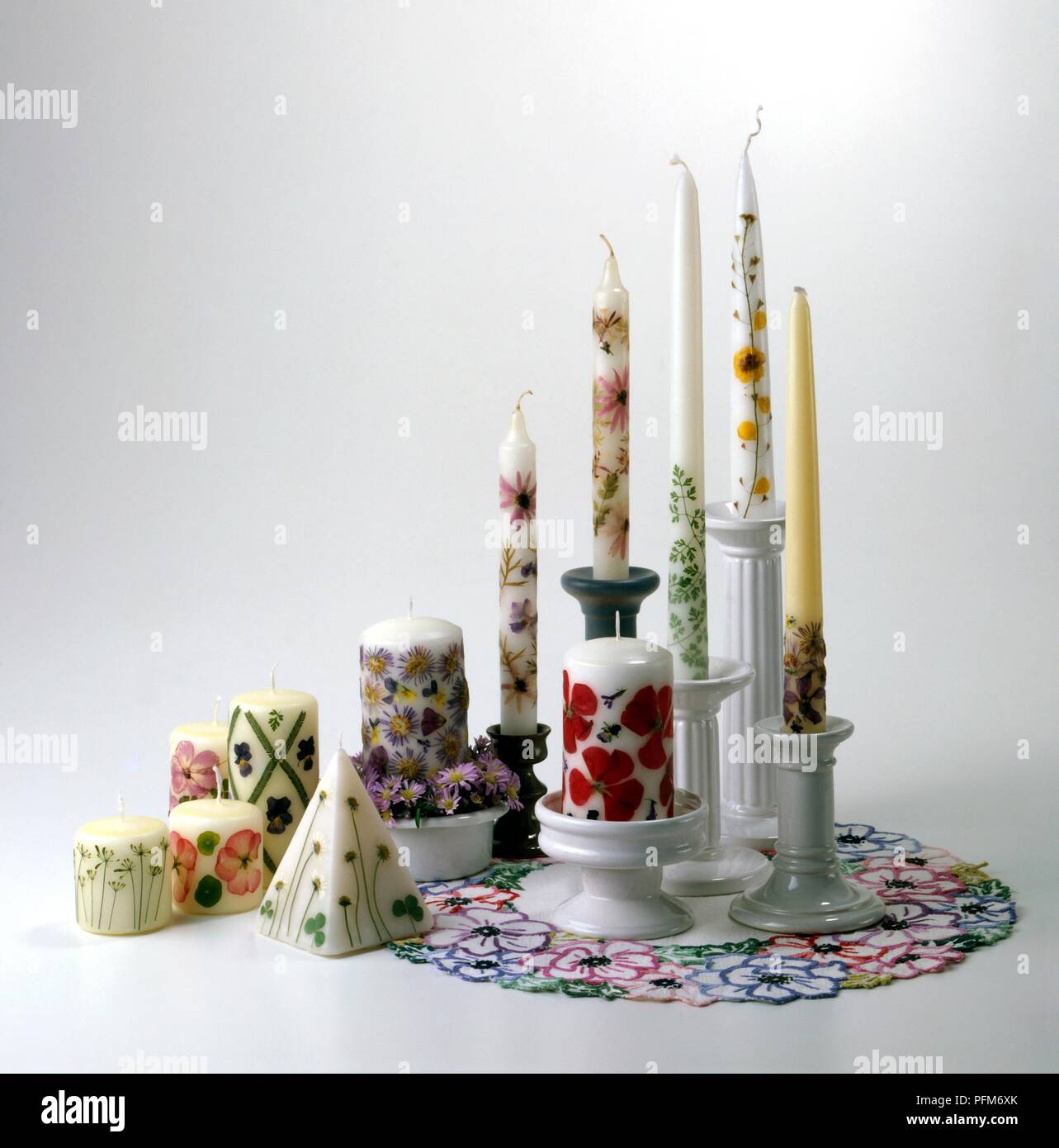 Candles decorated with floral designs Stock Photo