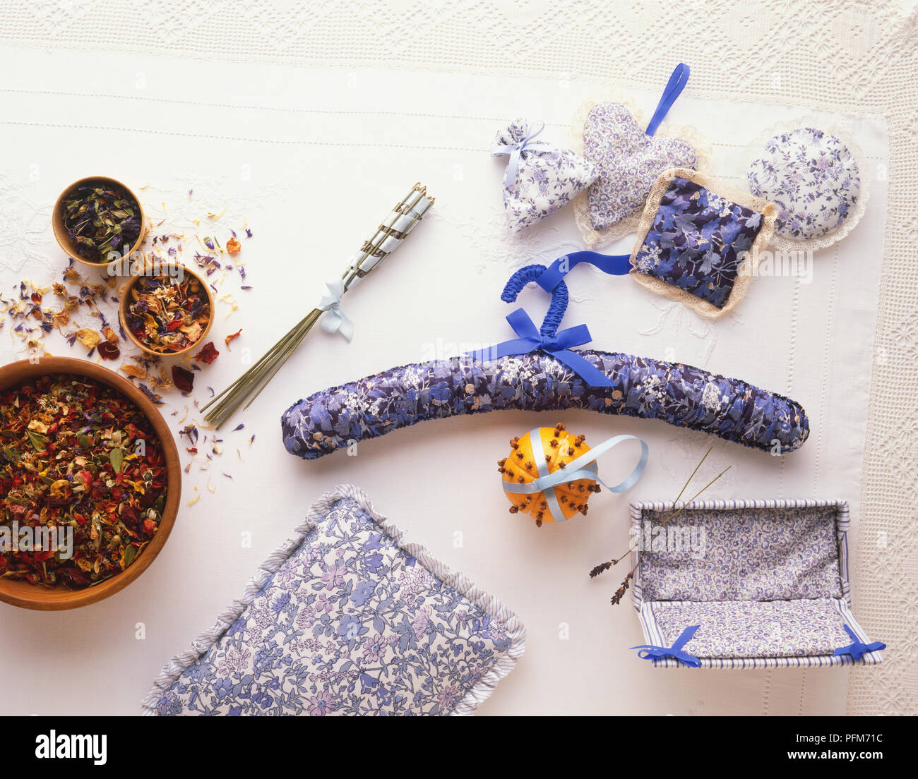 Selection of herbal fragrance ornaments, including potpourri, herb pillow, Lavender bundle, pomander, perfumed box, scented hanger and lavender bags, close up Stock Photo