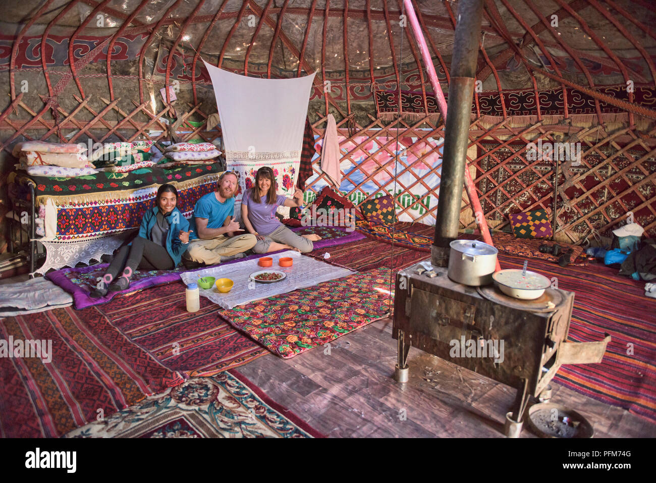 Tourists at Kyrgyz yurt camp, Pshart Valley, Tajikistan Stock Photo