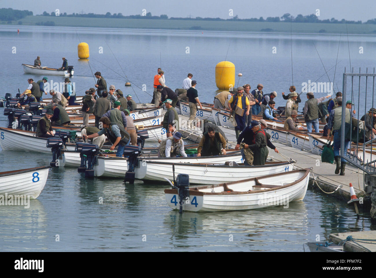 Fishermen on docked fishing boats getting ready to set off Stock Photo ...