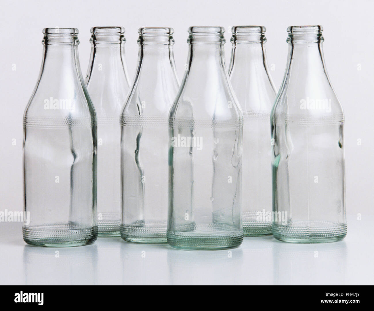 Six clear glass bottles Stock Photo Alamy