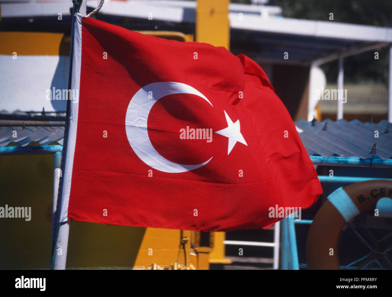The flag of Turkey blowing in the breeze. The flag has been in use since 1844 and officially adopted 5 June 1936. The nickname of the Turksih people for this flag is ''ay yildiz'' meaning moon star. Stock Photo