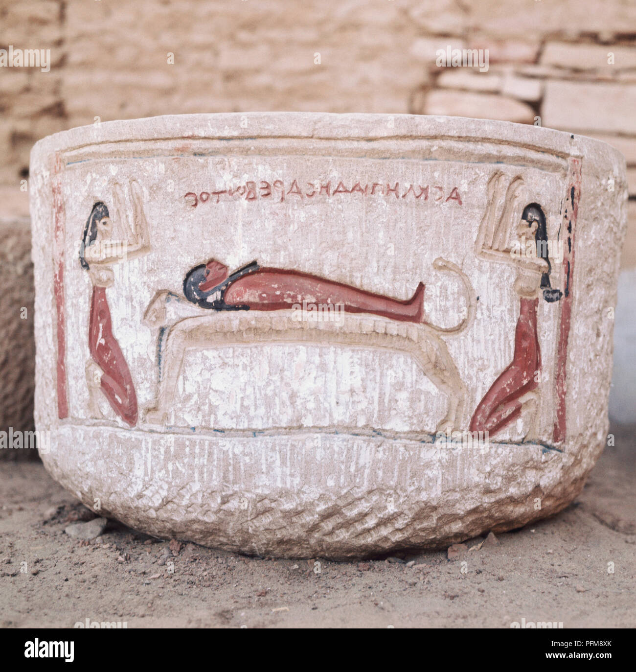 Egypt, Komombo, Sarcophagus at the Temple of Haroeris depicting Isis and Nephys Lamenting, carved and painted on stone. Stock Photo