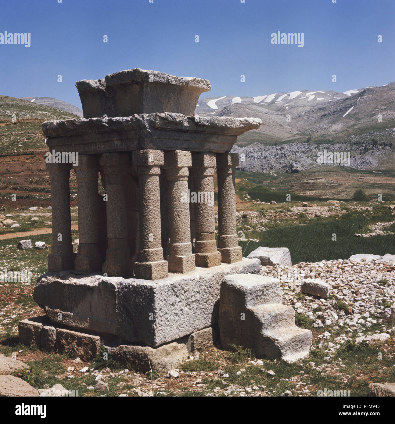 The Temple of Adonis altar with partially snow-covered mountains in the background, Fakra, Lebanon. Stock Photo
