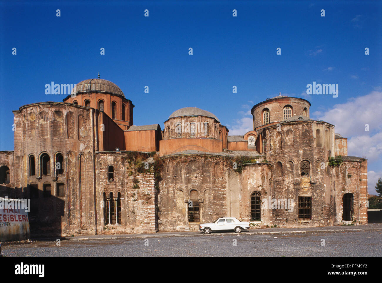 Asia, Turkey, Istanbul, exterior of the Church of the Pantocrator, built by Empress Irene in the 12th century, red roof, white car parked outside. Stock Photo