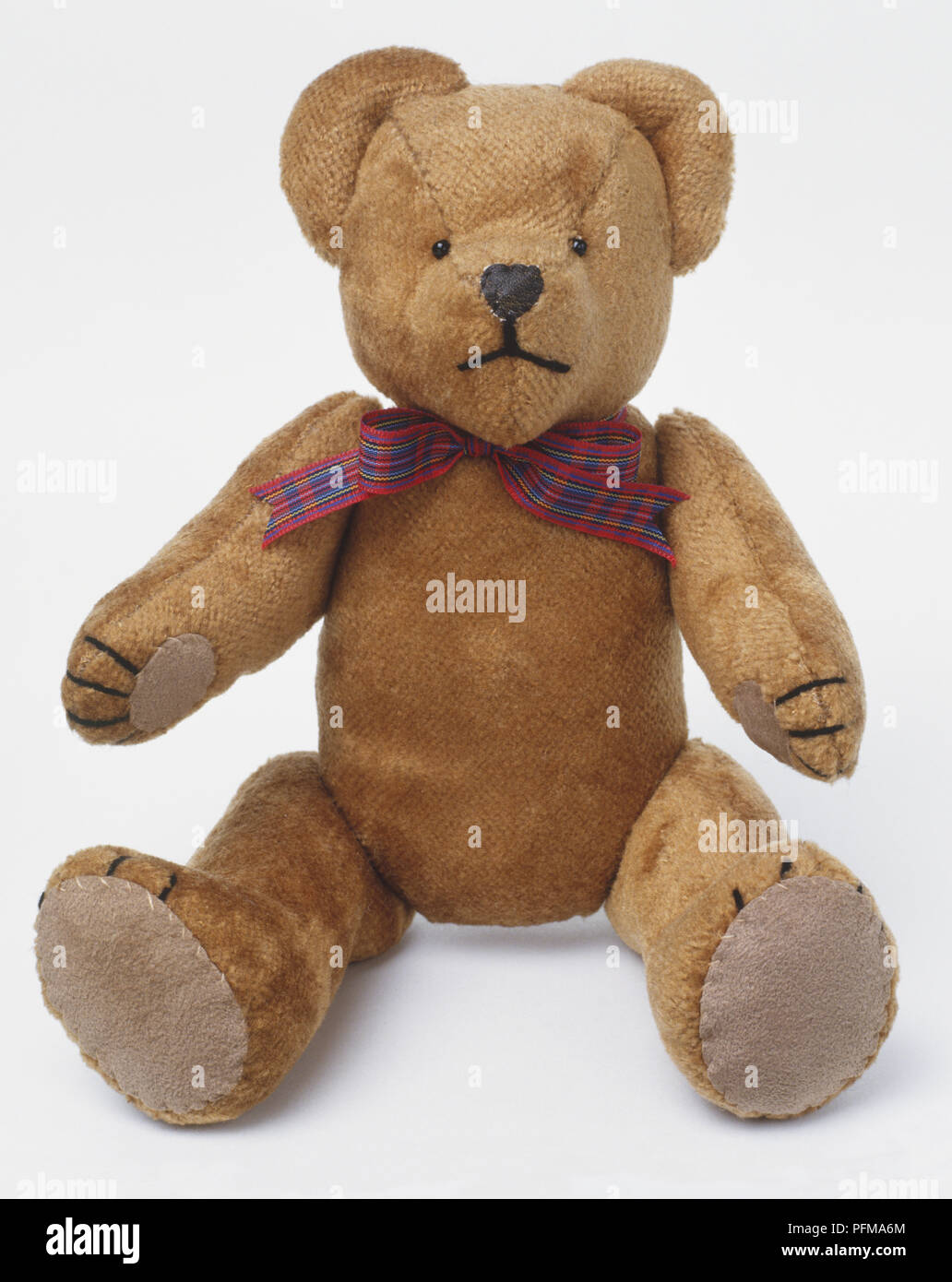 Bear Artists: Sat 1992 velveteen teddy bear with tartan bow tie, front view Stock Photo