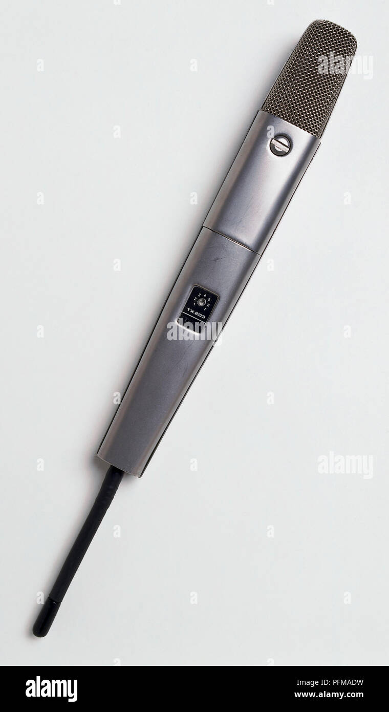 Hand-held microphone with an on-off switch Stock Photo - Alamy