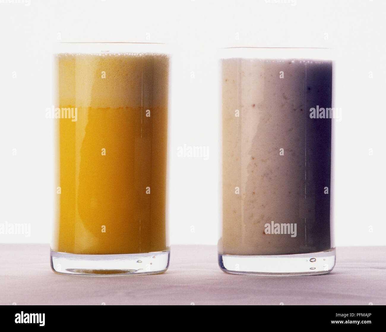 Typical Indian drinks, glasses of Kesar, yellow coloured Saffron flavoured lassi, and white