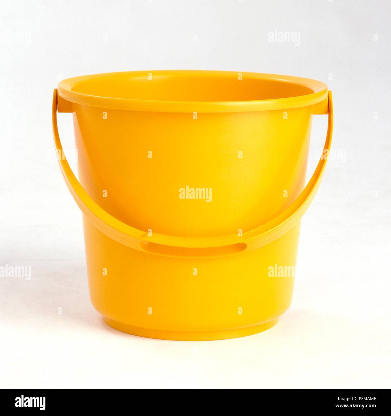 Bright yellow plastic bucket Stock Photo Alamy