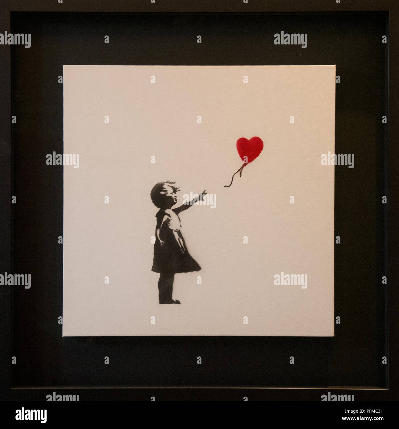 'Girl with balloon' from Banksy at exposition at MOCO museum in Amsterdam, Holland Stock Photo