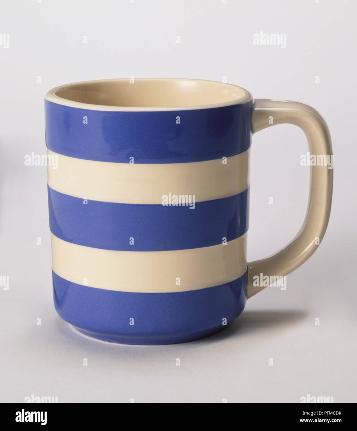 Blue-and-white striped Cornishware mug Stock Photo