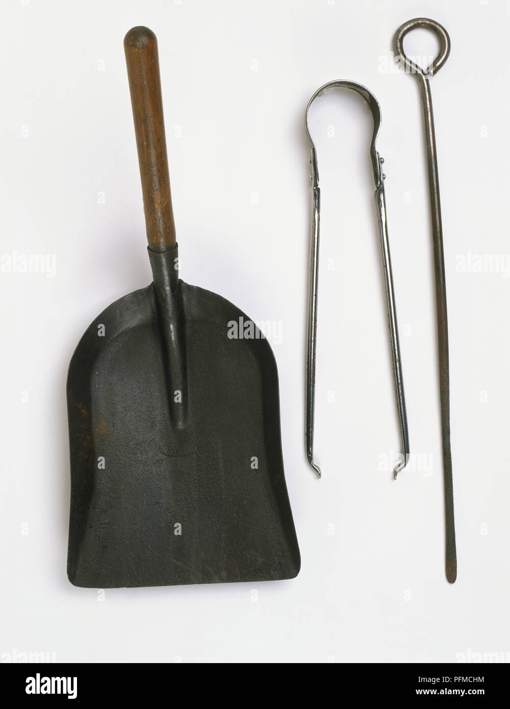 Poker, tongs and shovel, used for assembling and stoking an open fire, and clearing away ashes. Stock Photo