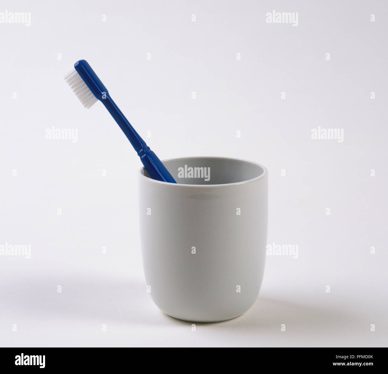 156). Toothbrush in a ceramic mug Stock Photo