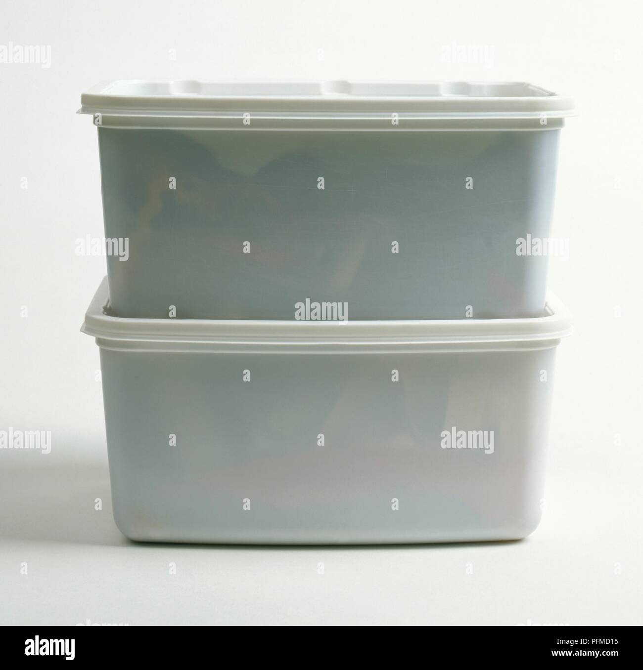 Two plastic containers on top of each other Stock Photo - Alamy