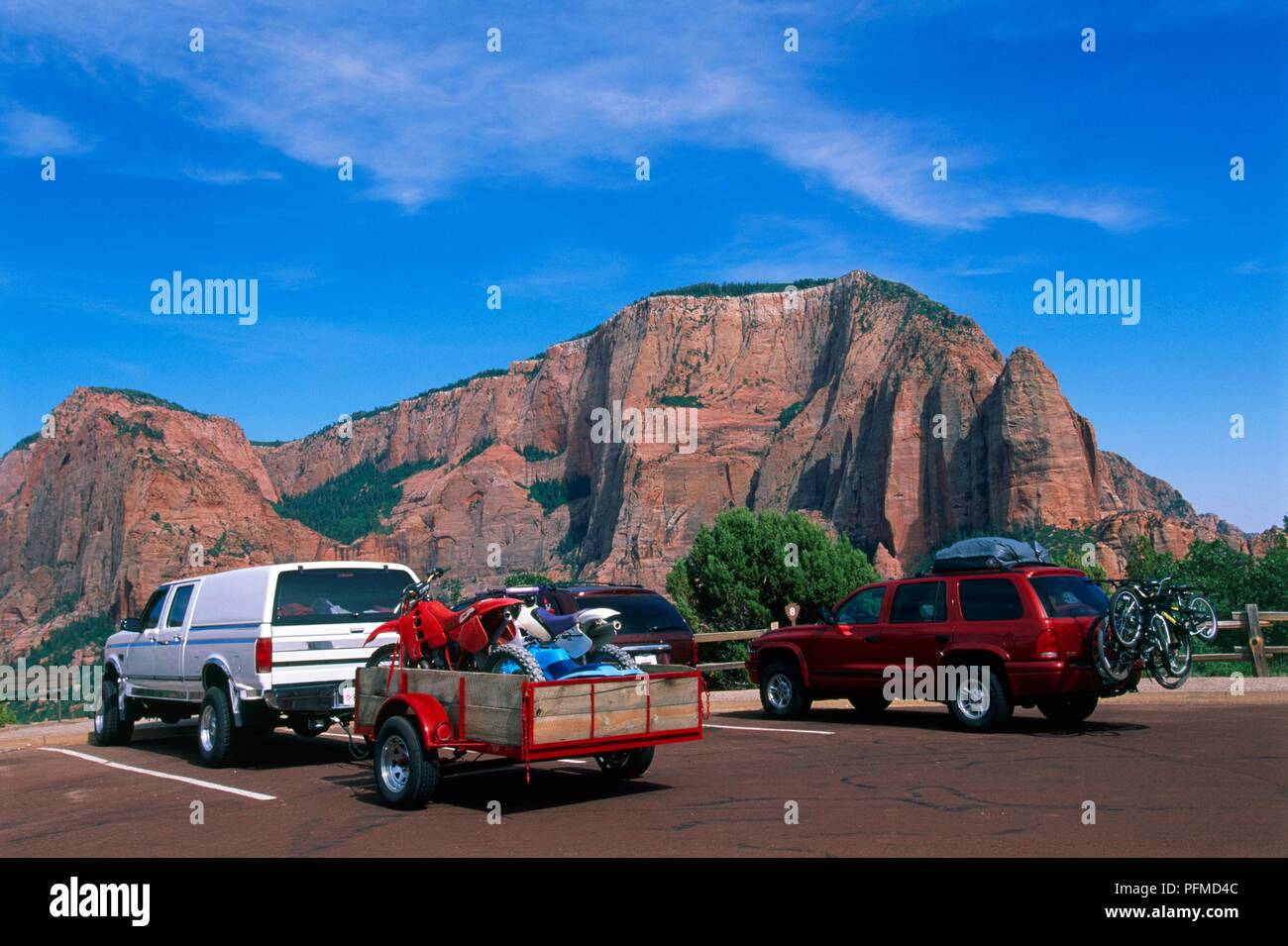 USA, Nevada, sports utility vehicles parked in view of mountains Stock Photo