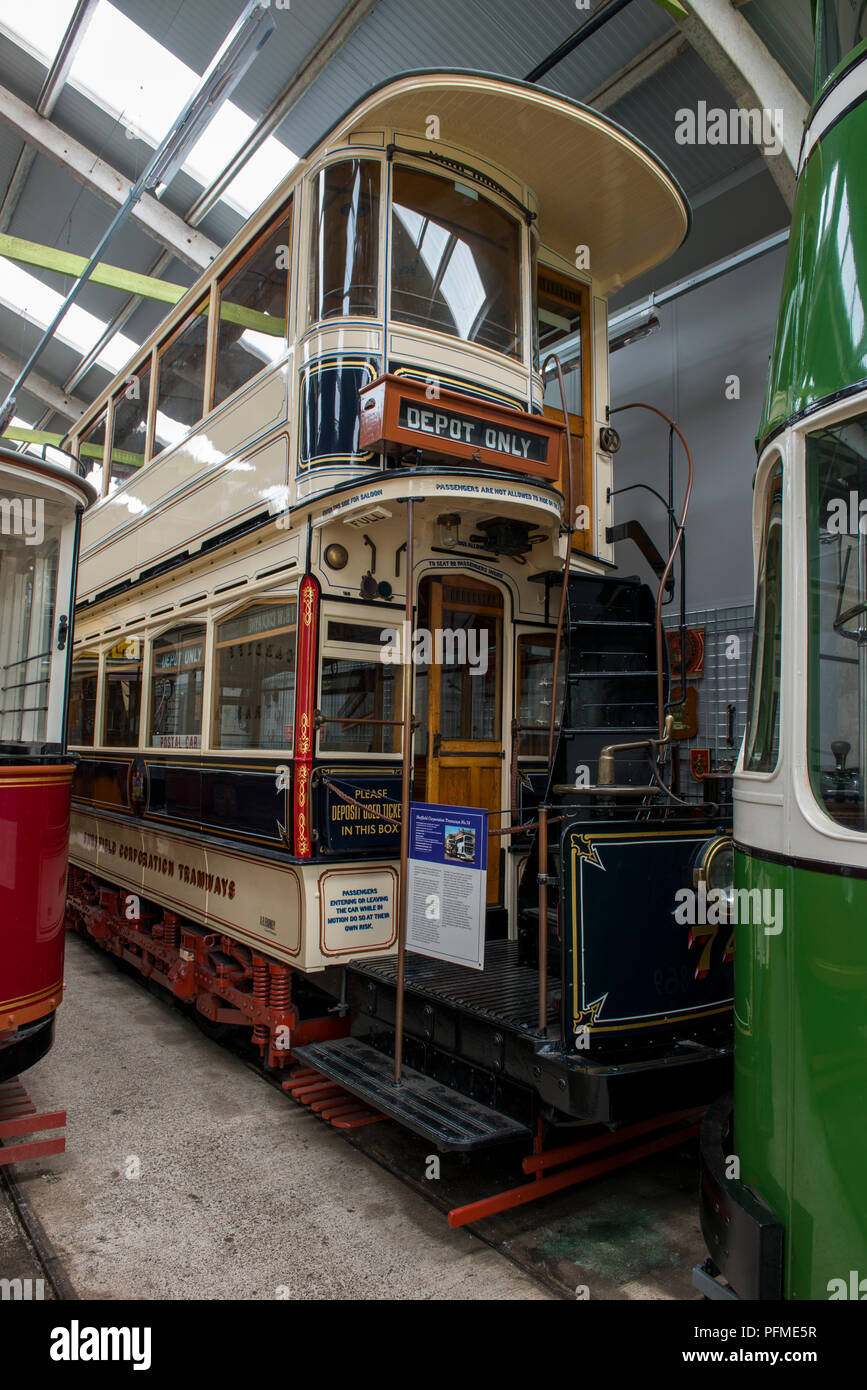 Exhibits are stored in the tram sheds and some await their turn for use within Crich Tramway Village, Derbyshire Such as this early Sheffield Tram Stock Photo