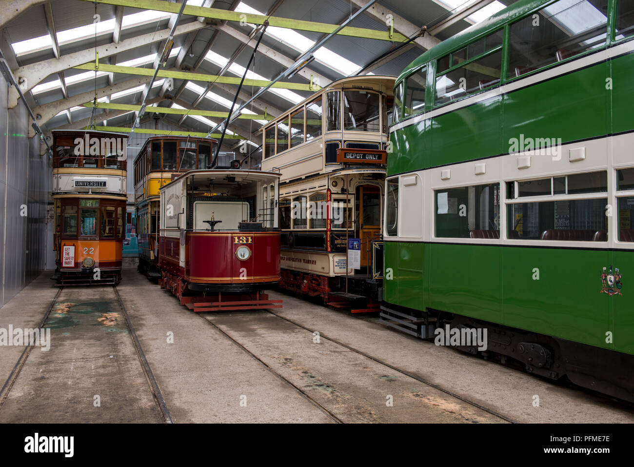 Exhibits are stored in the tram sheds and some await their turn for use within Crich Tramway Village, Derbyshire 19/08/2018 Stock Photo