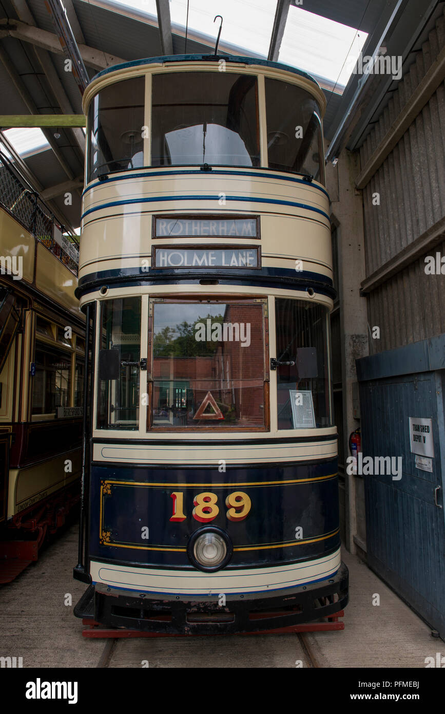 Exhibits are stored in the tram sheds and some await their turn for use within Crich Tramway Village, Derbyshire Such as this Standard Sheffield Tram  Stock Photo