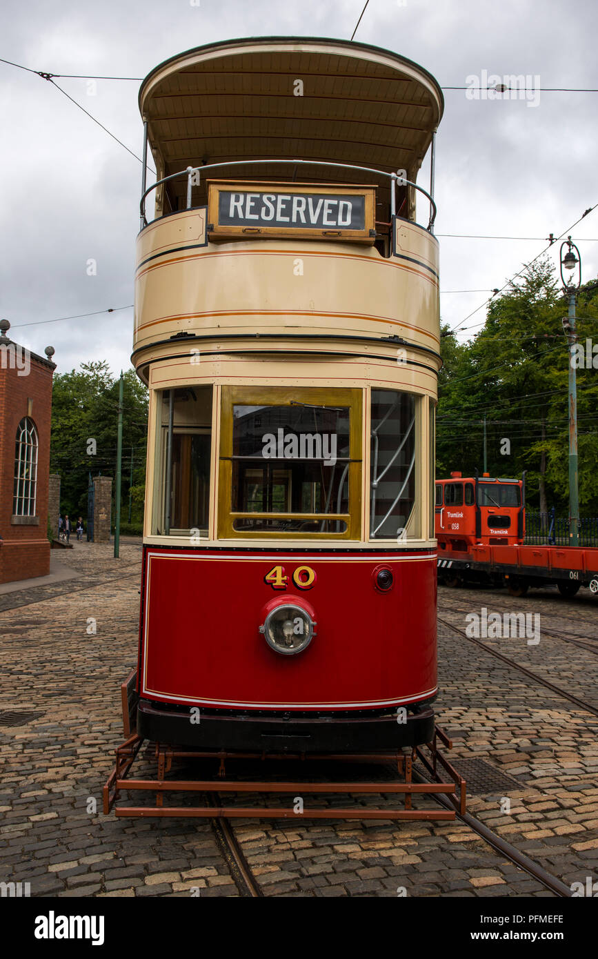 Exhibits are stored in the tram sheds and some await their turn for use within Crich Tramway Village, Derbyshire Stock Photo