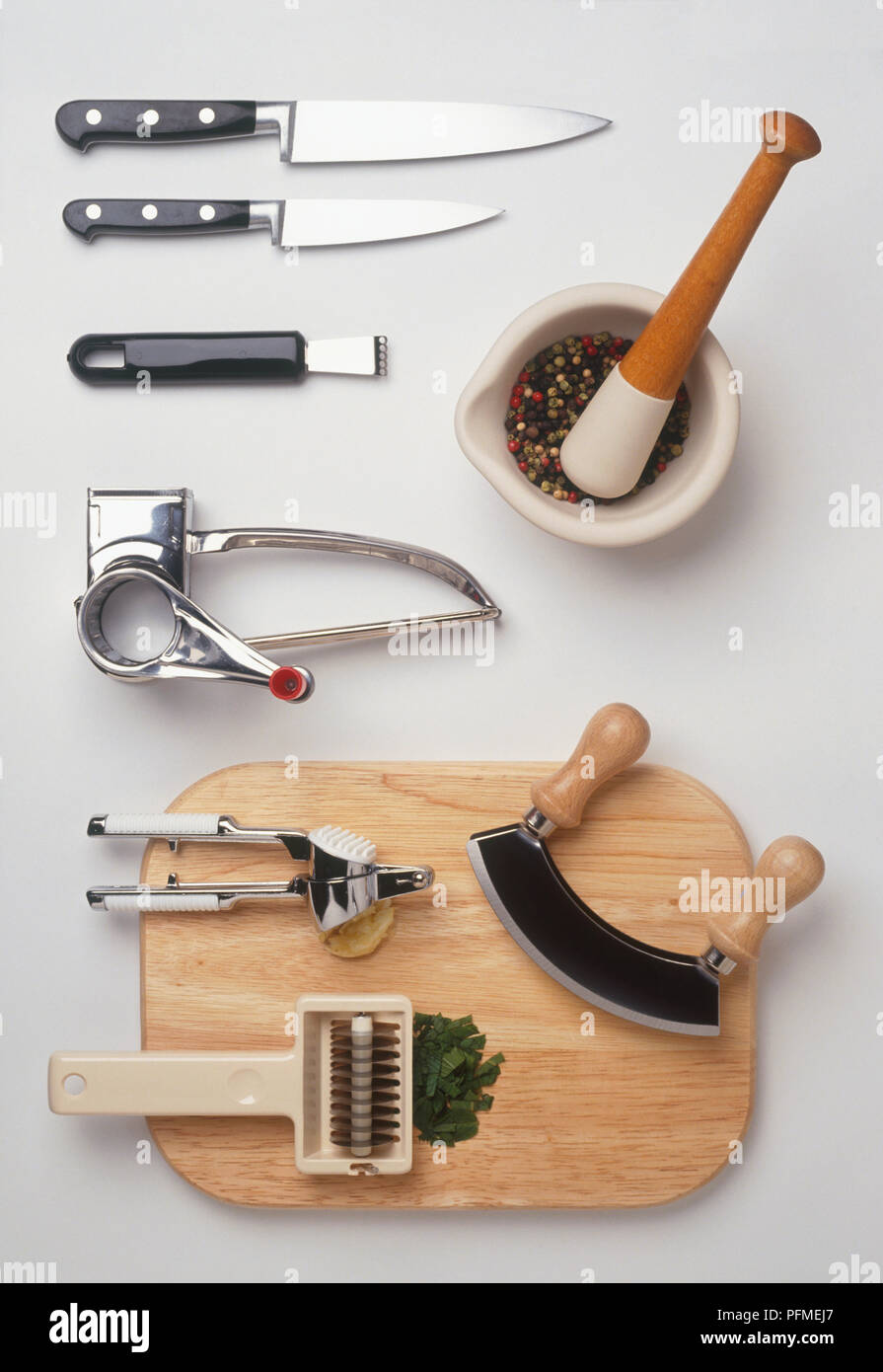 Cooking utensils, including rotary grater, knives, mezzaluna, pestle