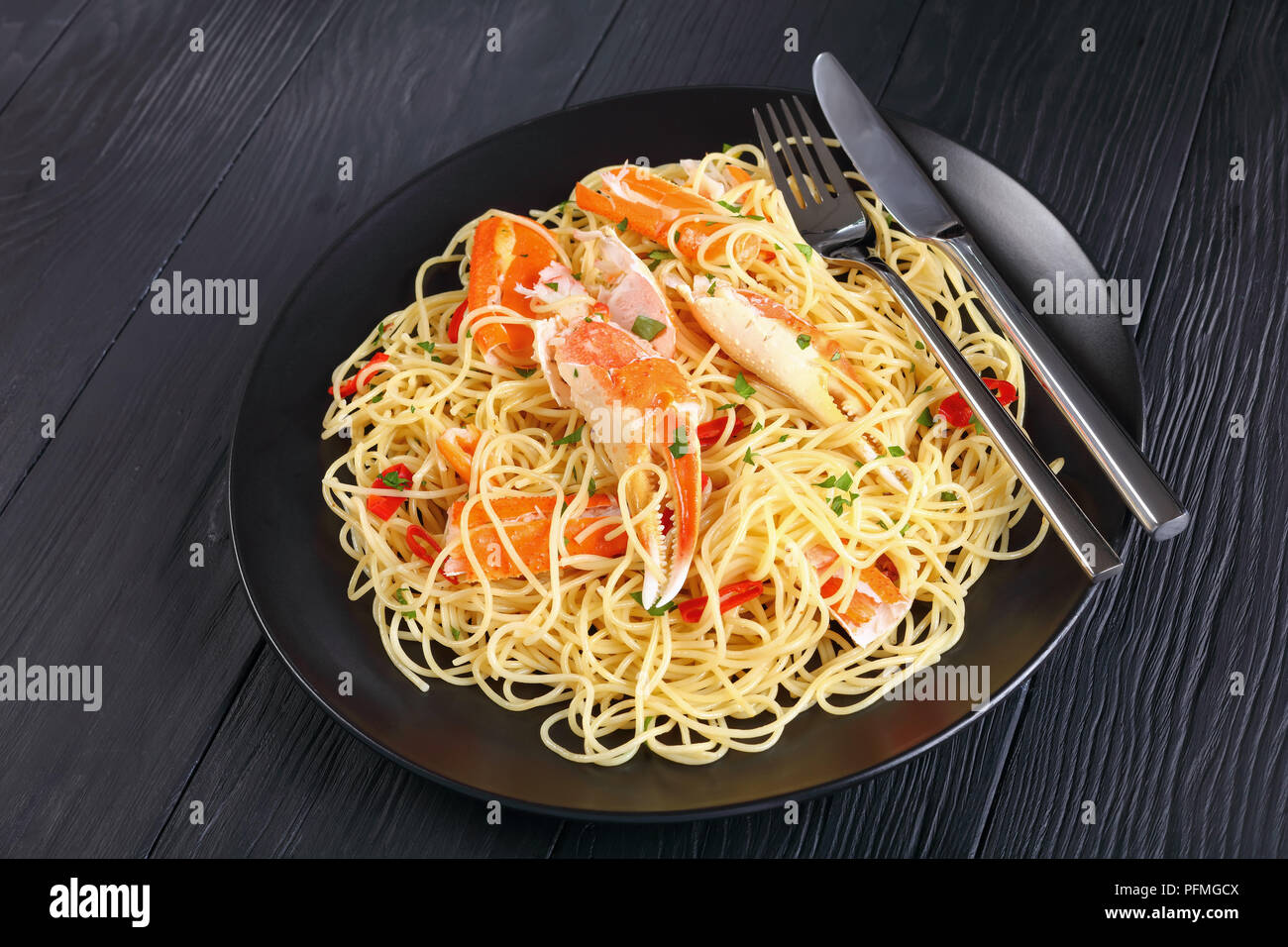 closeup of spaghetti with cracked Crab in Spicy White Wine Sauce