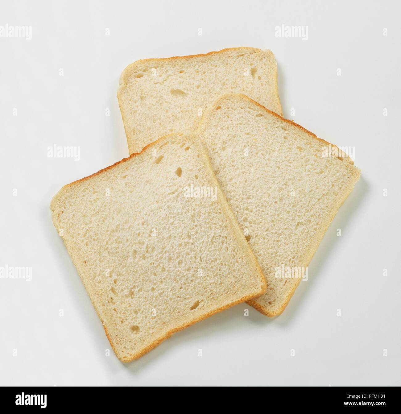 Three slices of white bread Stock Photo - Alamy