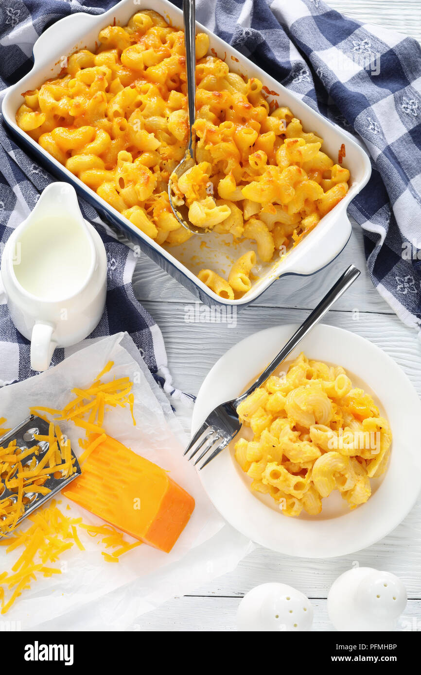 classic Baked Homemade Macaroni and Cheese in baking dish and served on