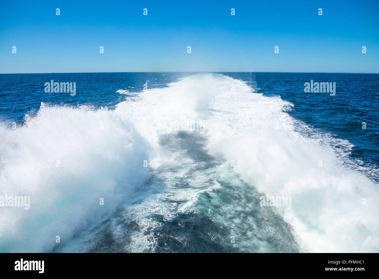 Trail print on water surface behind of speed boat Stock Photo - Alamy