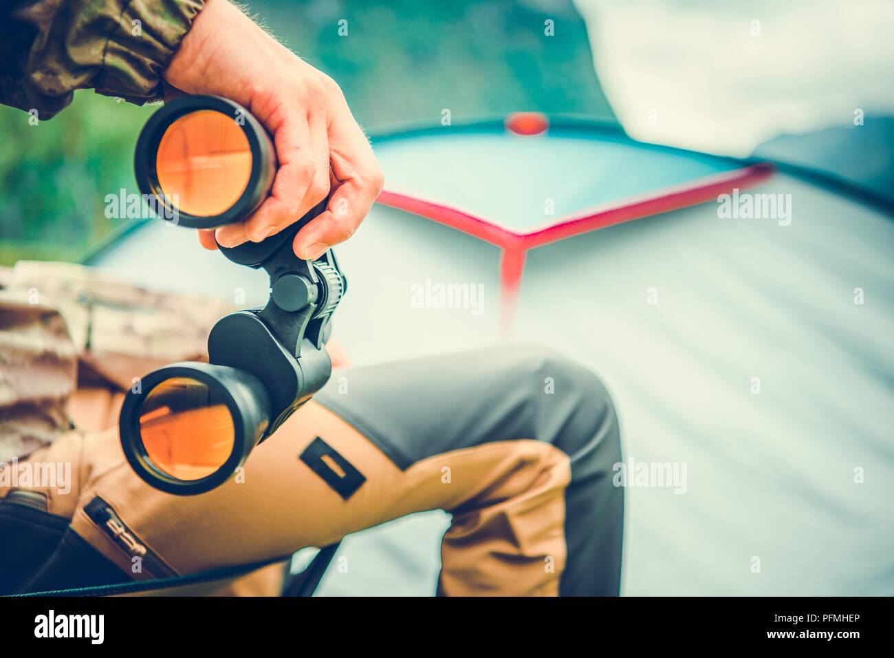Wildlife Viewing and Hunting with Binoculars. Caucasian Men with Field Glasses. Closeup Photo