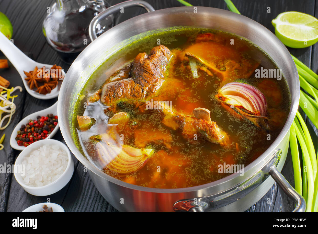 ingredients for Vietnamese soup Pho Bo, with raw beef, bone broth in a