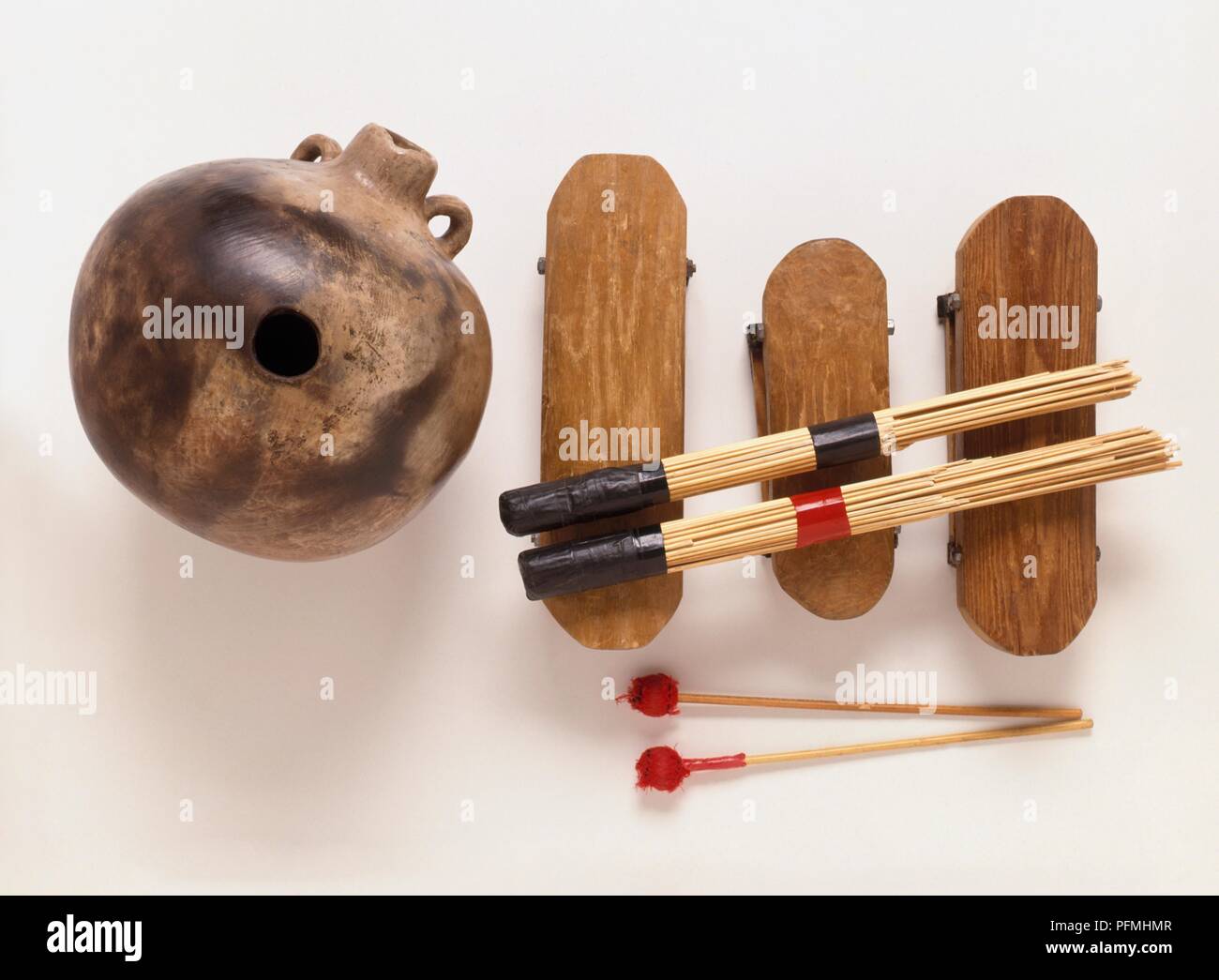 Percussion instruments, woodblocks with beaters and brushes, and a Ghanaian uduh Stock Photo