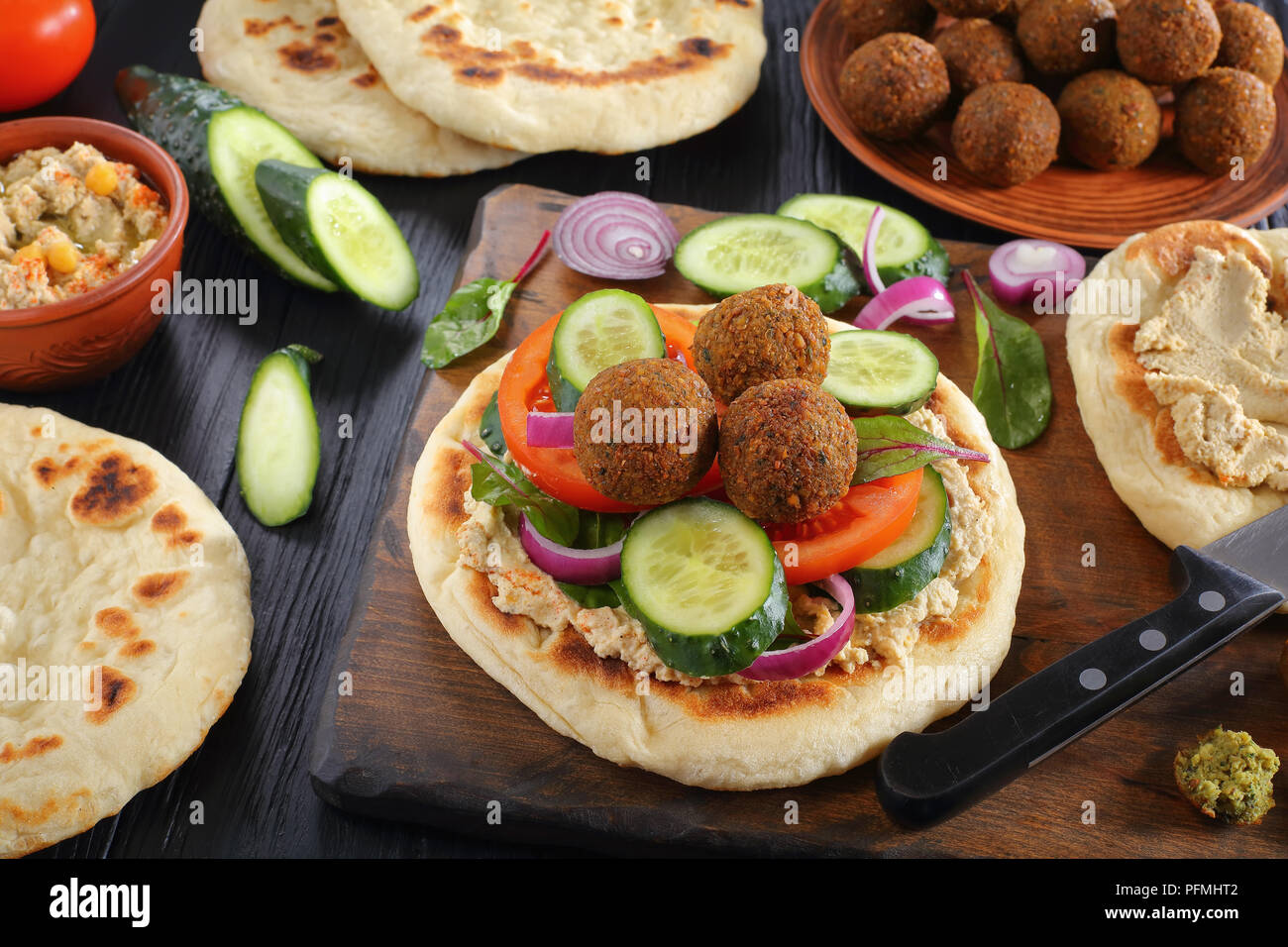 delicious Falafel balls on pan fried pita bread with Spicy Hummus
