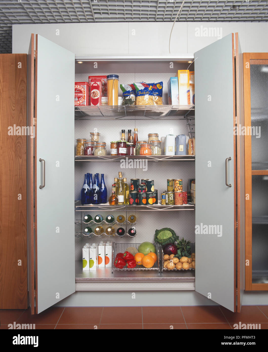 Modern Kitchen Larder With Stainless Steel Racking Shelves Stock