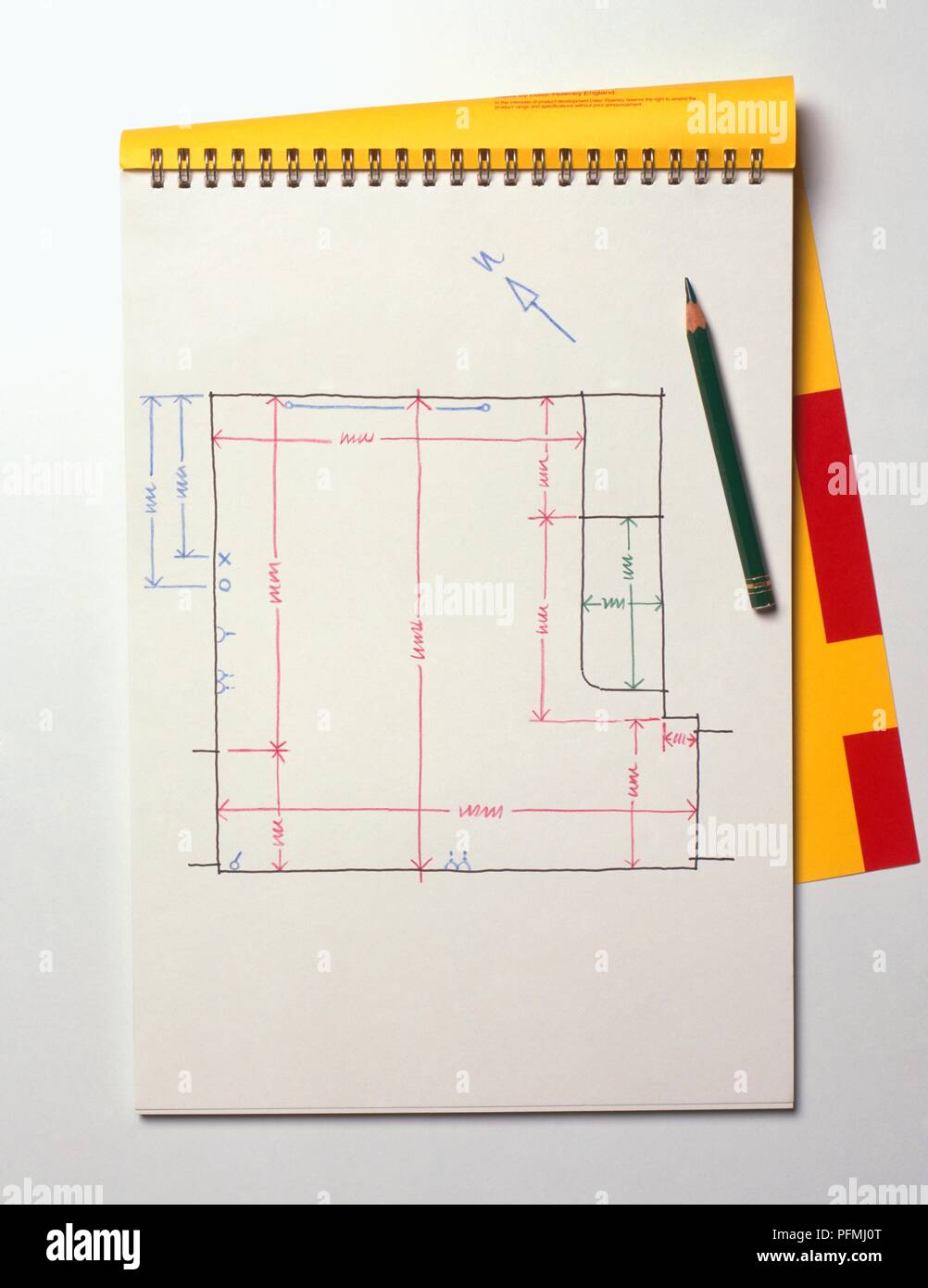 Design for domestic kitchen on notepad, with a pencil resting on top Stock Photo