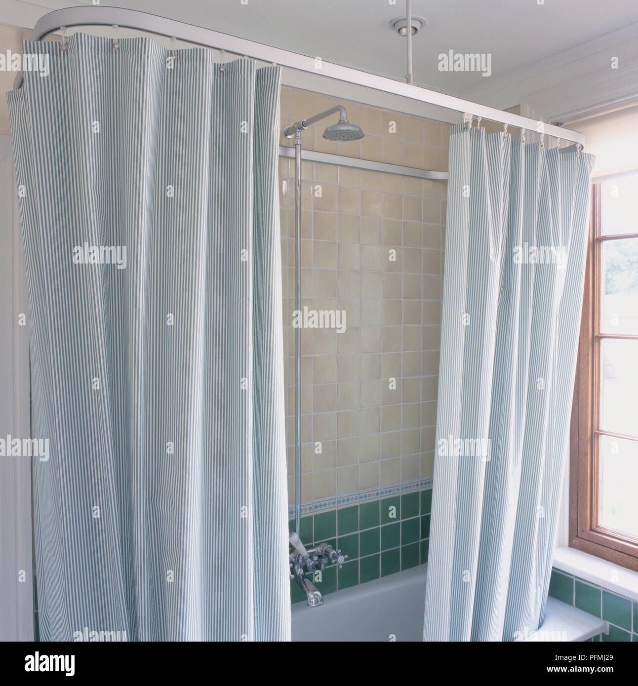 Shower curtains over bath, close-up Stock Photo
