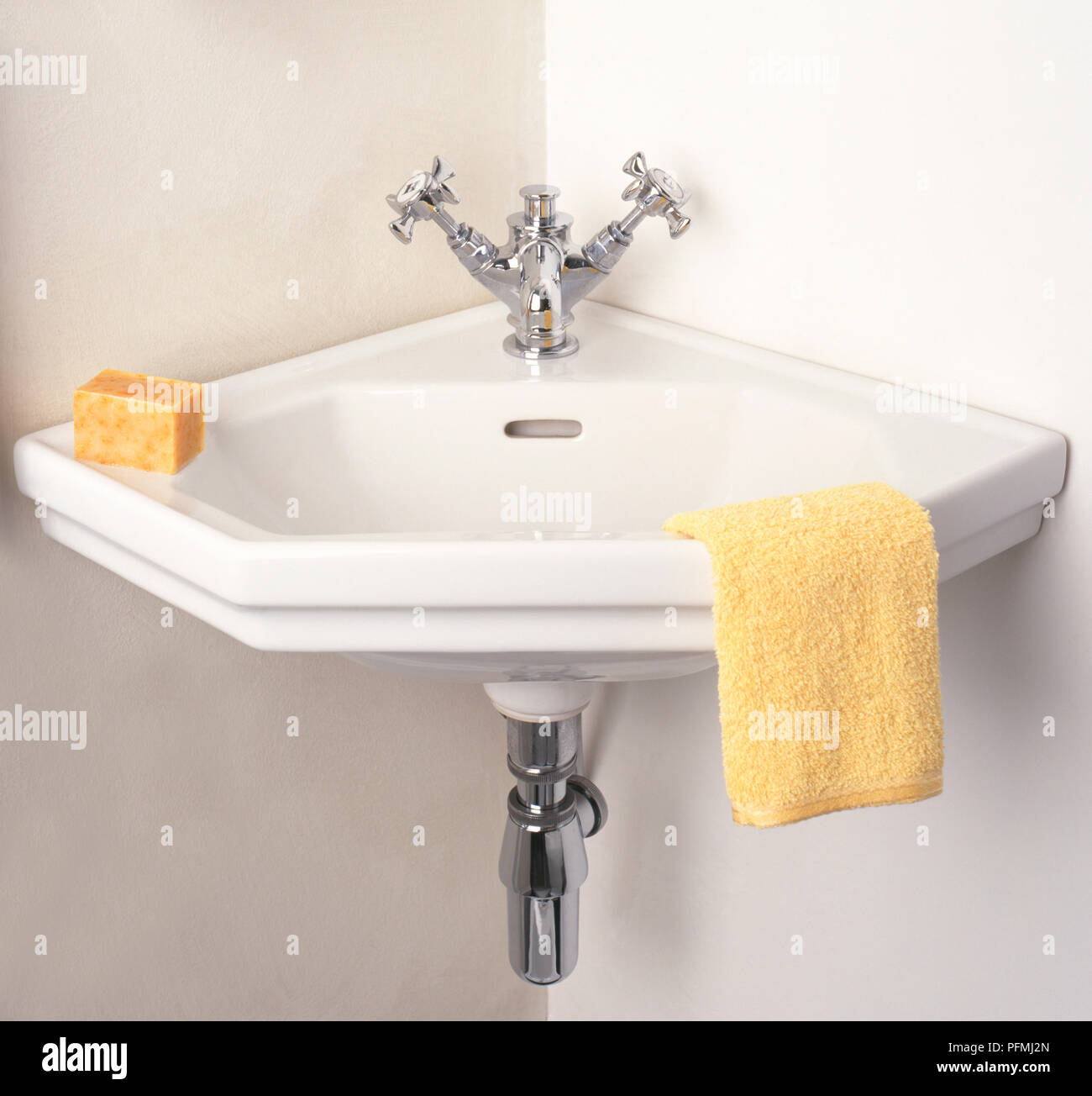 Corner wash basin in bathroom, with towel and soap Stock Photo Alamy