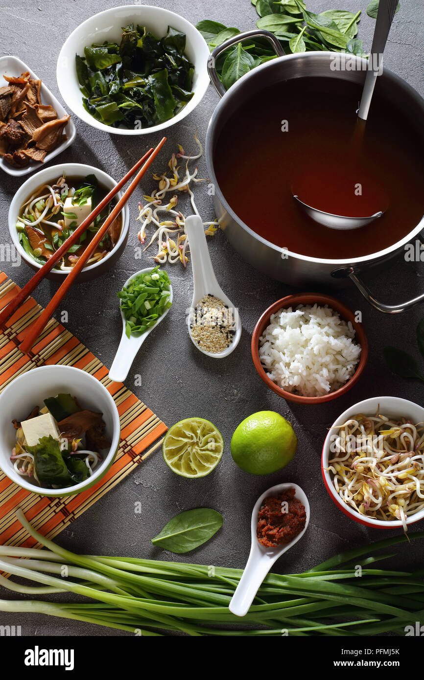 traditional japanese miso soup in a bowl with chopsticks. ingredients ...