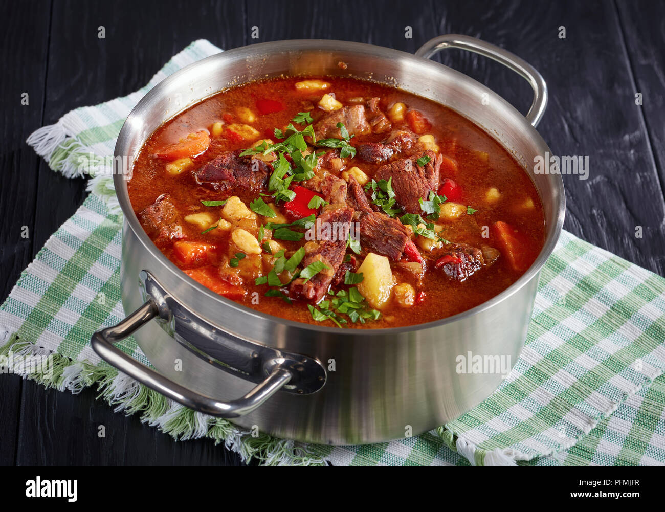 closeup of delicious hot hungarian goulash with beef meat, paprika